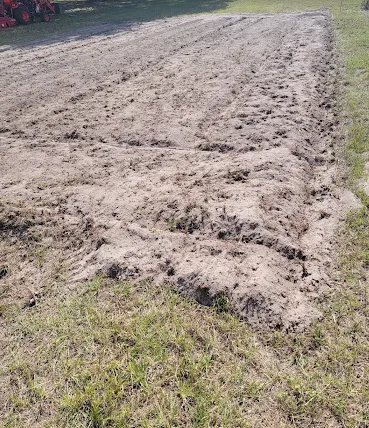Freshly rotor tilled garden soil rows on a Dunnellon FL home property